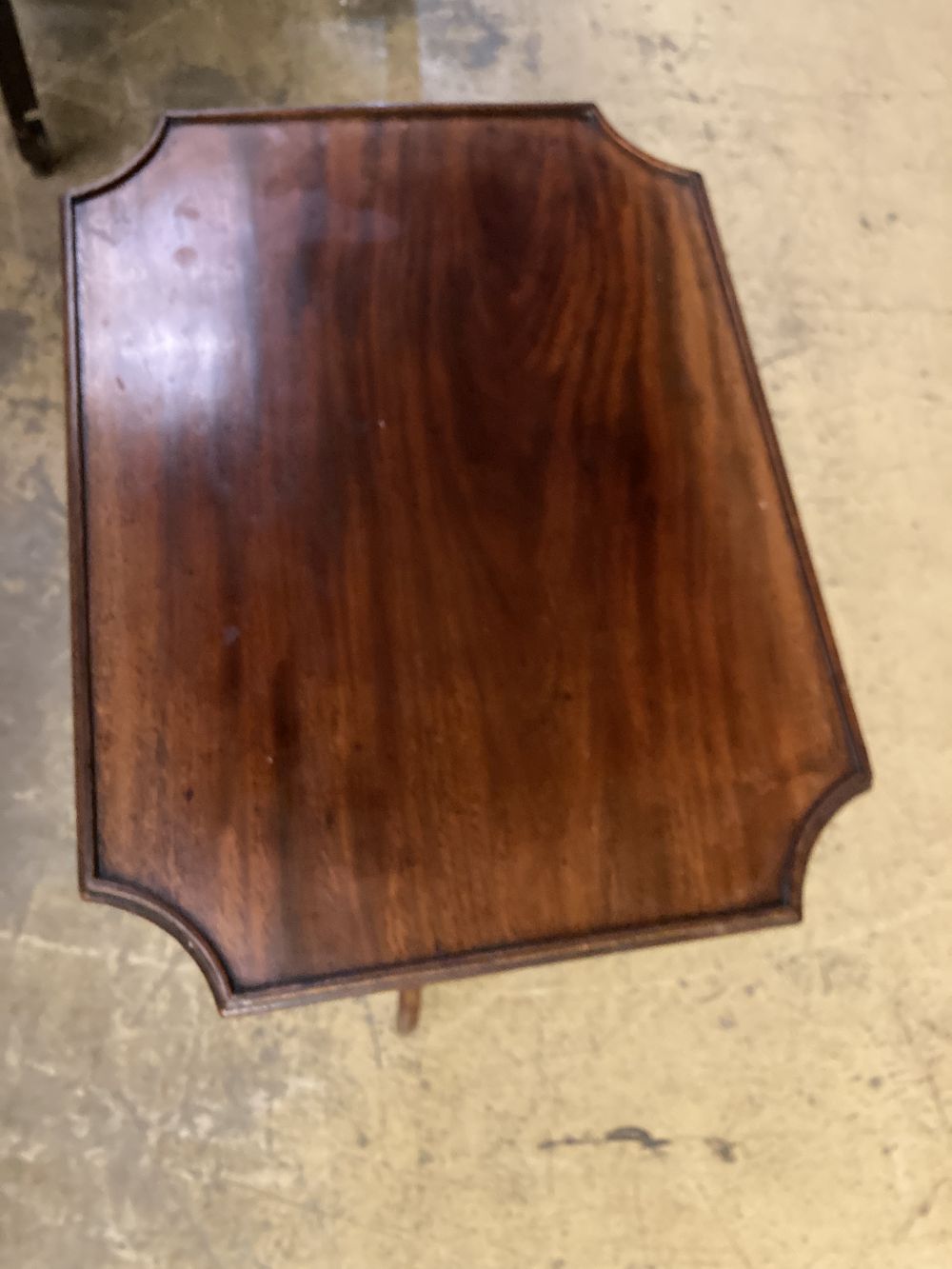 A Regency mahogany tilt top wine table, the rectangular top with re-entrant corners, width 53cm depth 40cm height 73cm